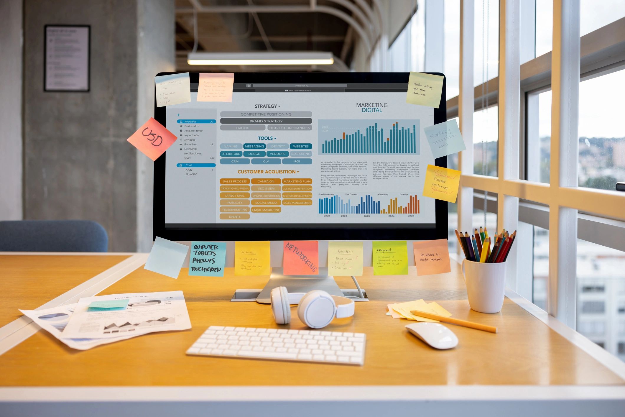 Planning documents and laptop on a desk
