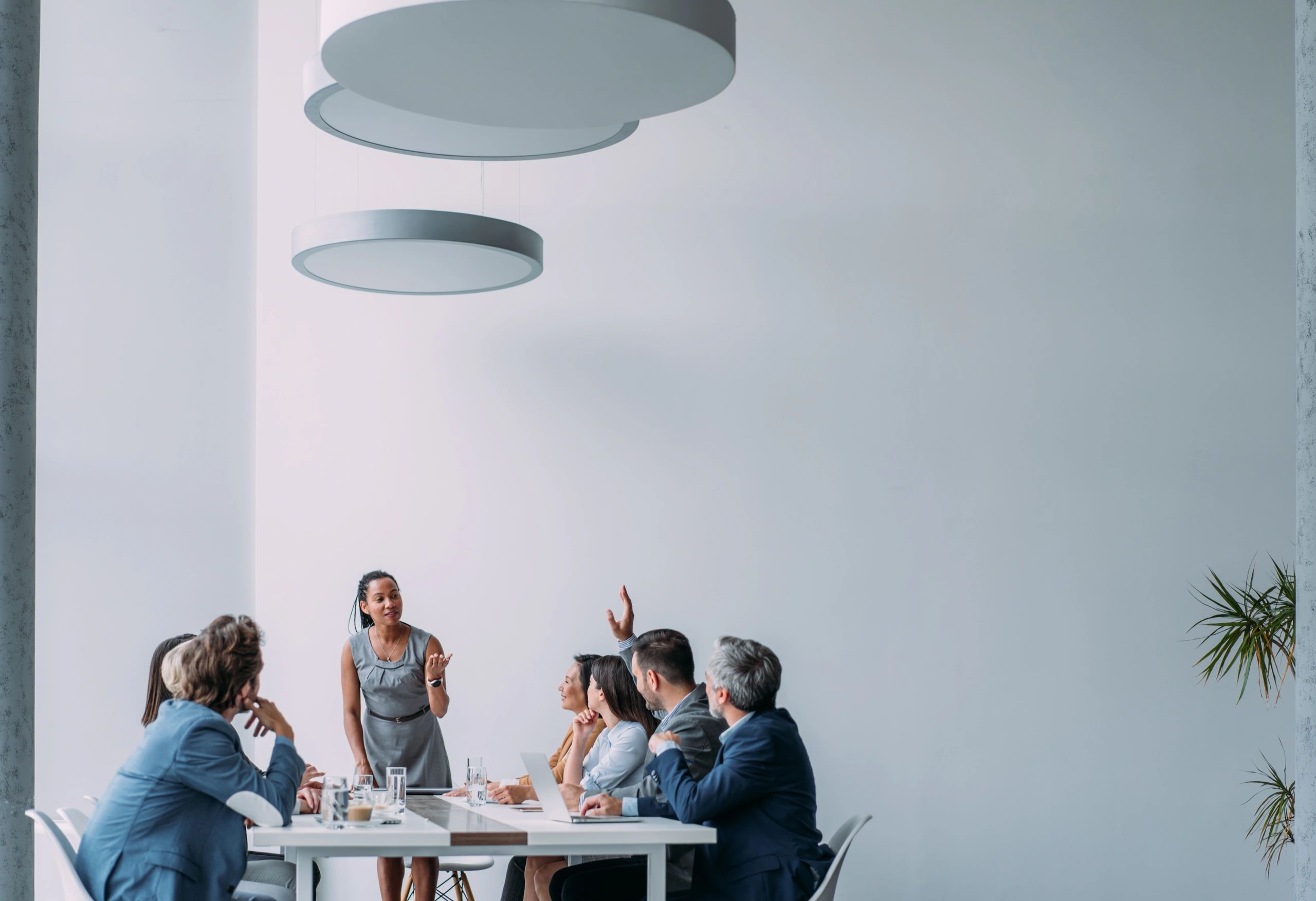 Consultant presenting process improvements to a team in a meeting room