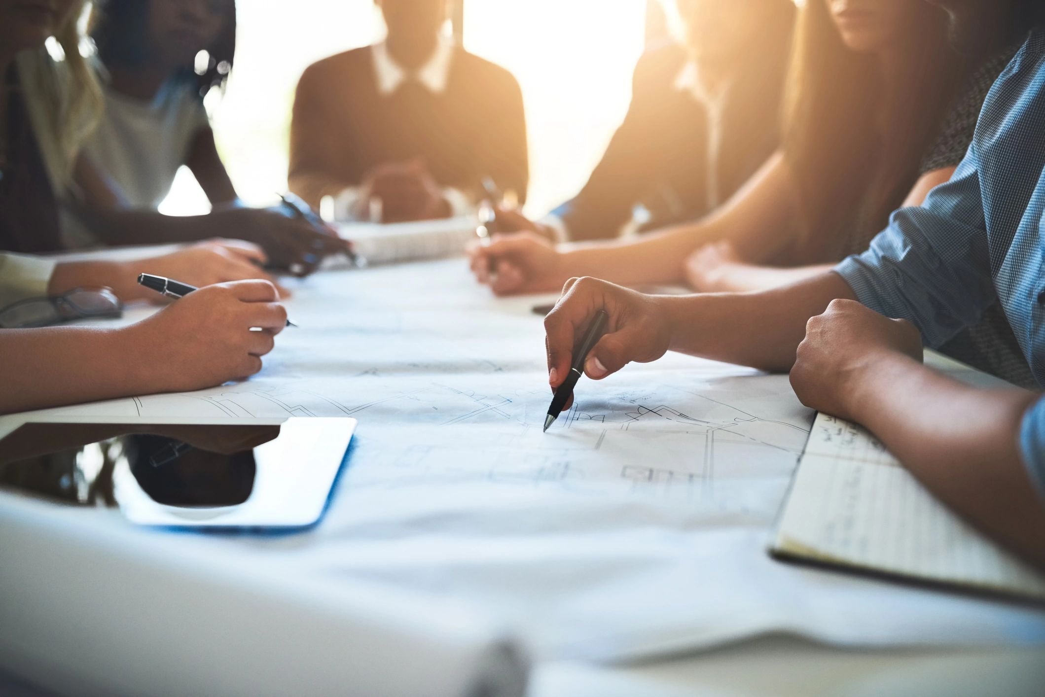 Consultants collaborating over project documents